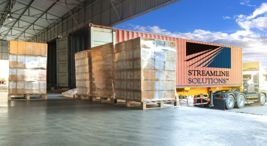 Freight transportation by trucks, trucks trailer docking loading cargo at warehouse